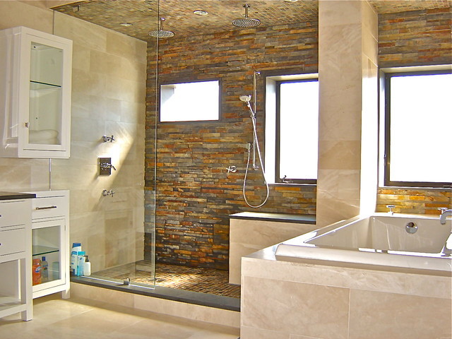 Inspiration for a mid-sized contemporary master bathroom in Cincinnati with flat-panel cabinets, white cabinets, an alcove tub, an open shower, slate, grey walls, limestone floors, beige floor and an open shower.