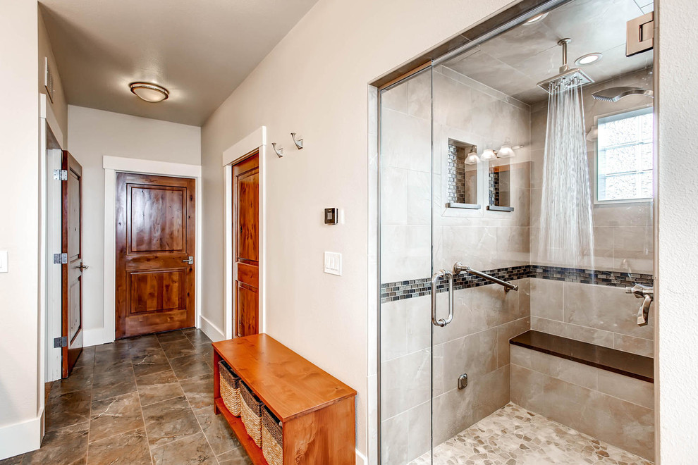 Example of a mid-sized transitional gray tile and porcelain tile porcelain tile corner bathtub design in Denver with shaker cabinets, medium tone wood cabinets, a one-piece toilet, gray walls, an undermount sink and solid surface countertops