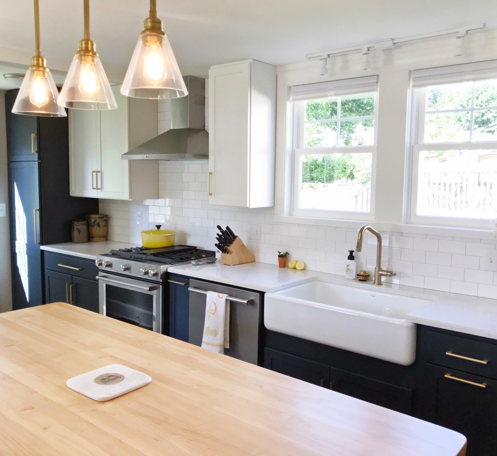 Inspiration for a transitional gray floor kitchen remodel with a farmhouse sink, quartz countertops and stainless steel appliances