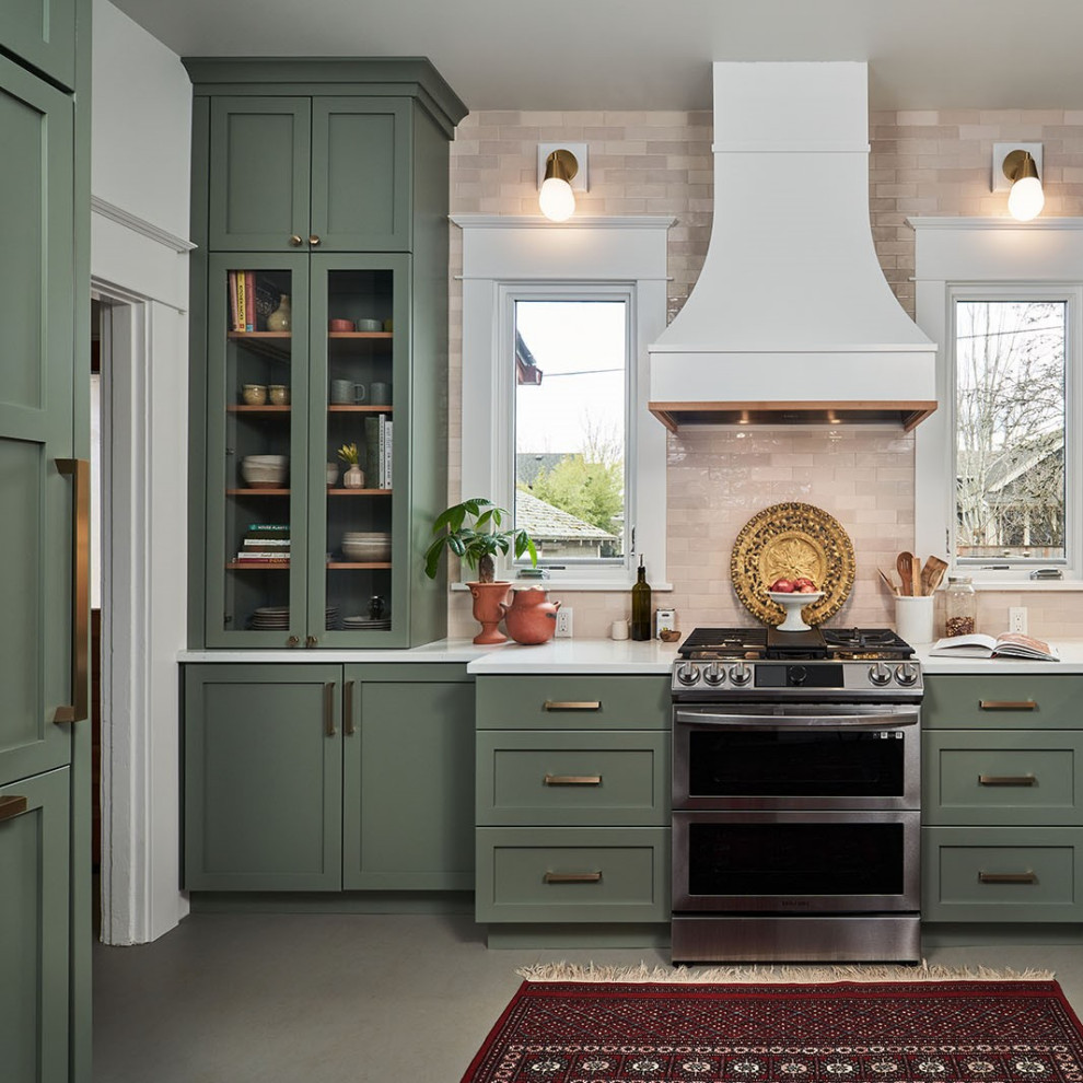 Eat-in kitchen - mid-sized transitional l-shaped beige floor eat-in kitchen idea in Portland with a farmhouse sink, shaker cabinets, green cabinets, quartzite countertops, beige backsplash, ceramic backsplash, no island and white countertops