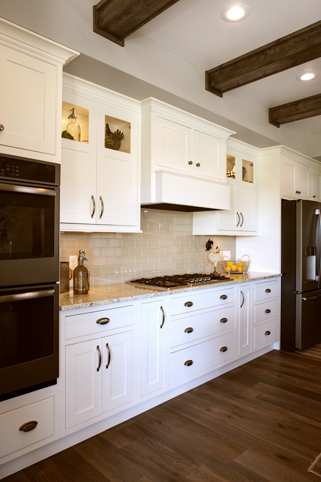Inspiration for a l-shaped kitchen remodel with stainless steel appliances and an island