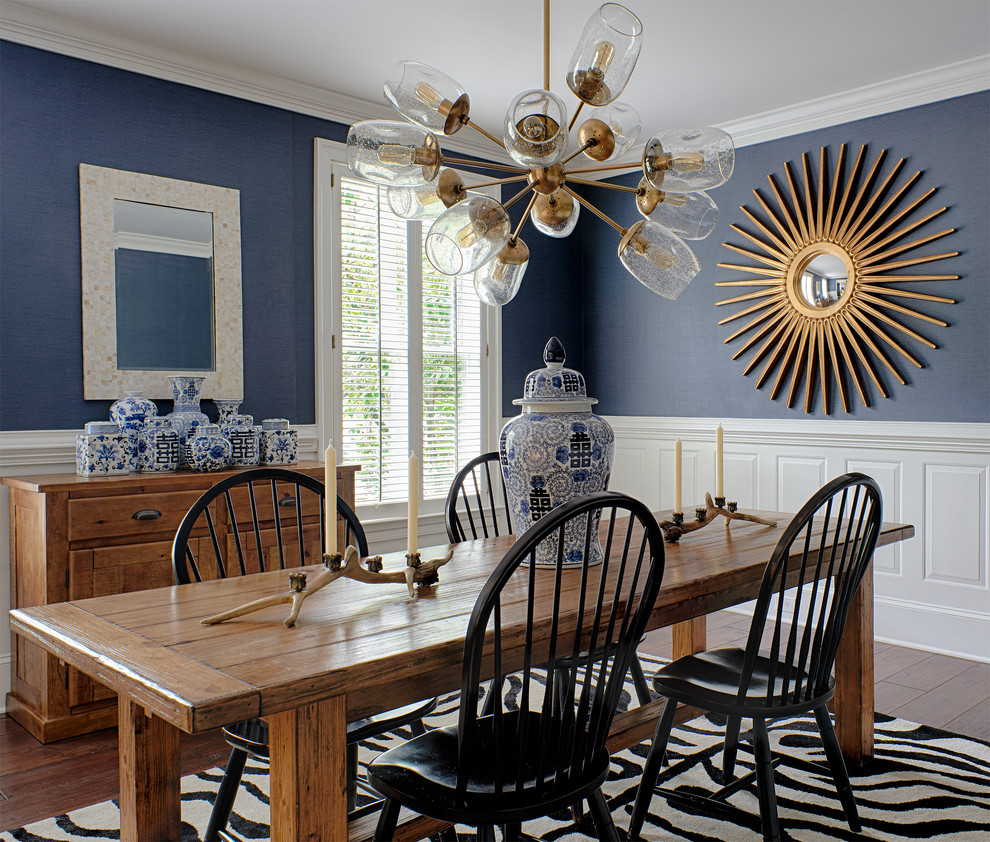 Photo of a transitional separate dining room in Philadelphia with blue walls, dark hardwood floors and no fireplace.