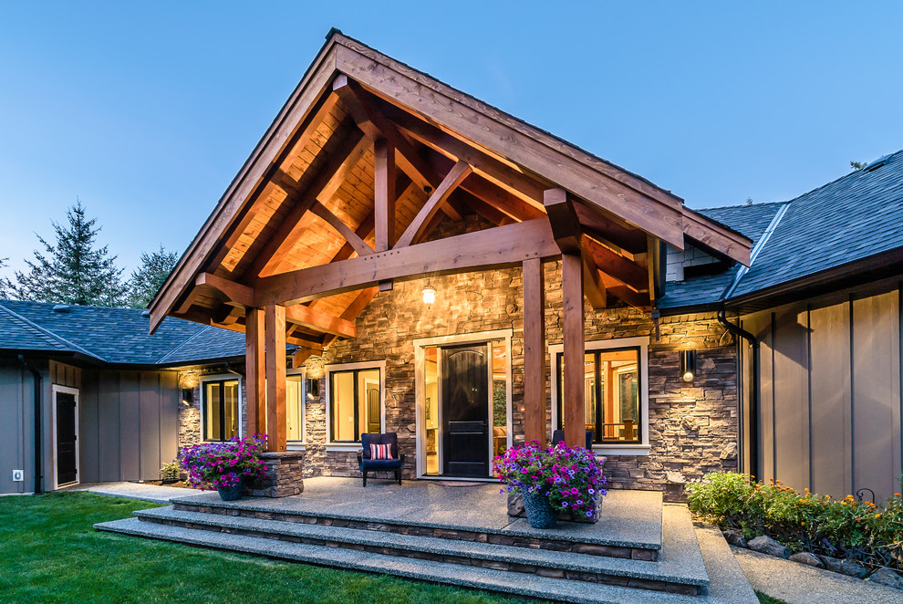 Inspiration for a mid-sized rustic two-story beige entryway remodel