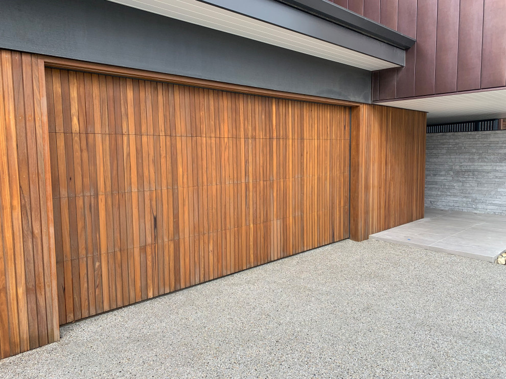 This is an example of a mid-sized modern attached garage in Newcastle - Maitland.
