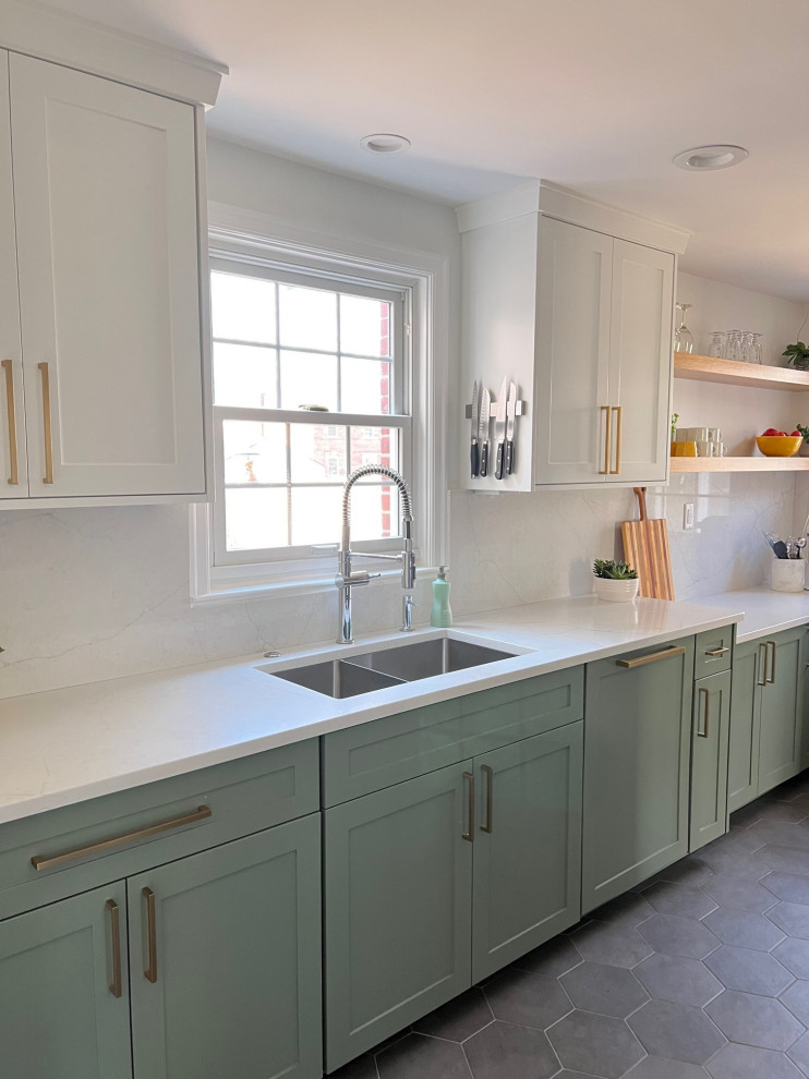 Small traditional galley enclosed kitchen in Indianapolis with a submerged sink, shaker cabinets, green cabinets, engineered stone countertops, white splashback, engineered quartz splashback, stainless steel appliances, porcelain flooring, no island, grey floors and yellow worktops.