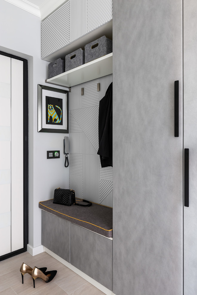 This is an example of a small contemporary mudroom in Saint Petersburg with grey walls, a single front door, a white front door and beige floor.