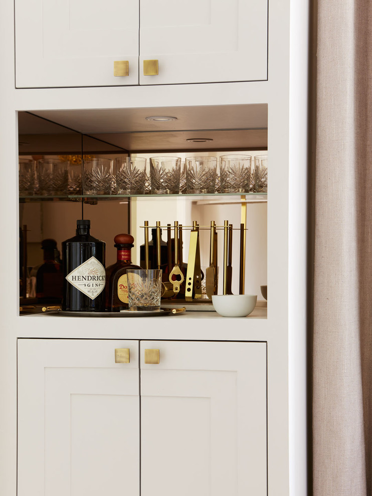 Inspiration for a traditional home bar in London.