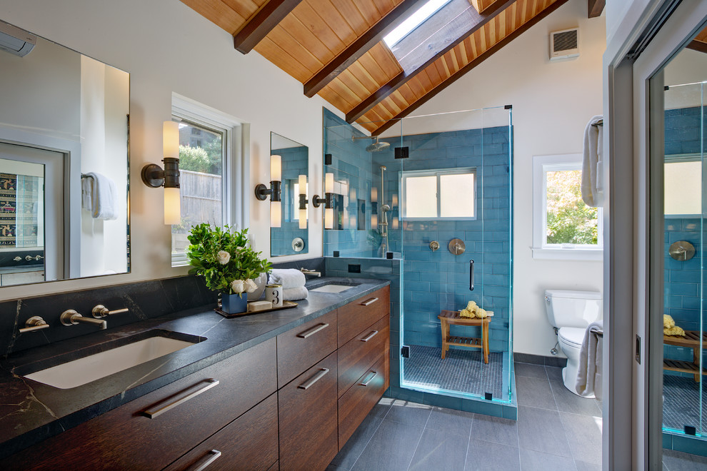 This is an example of a transitional bathroom in San Francisco with a hinged shower door.