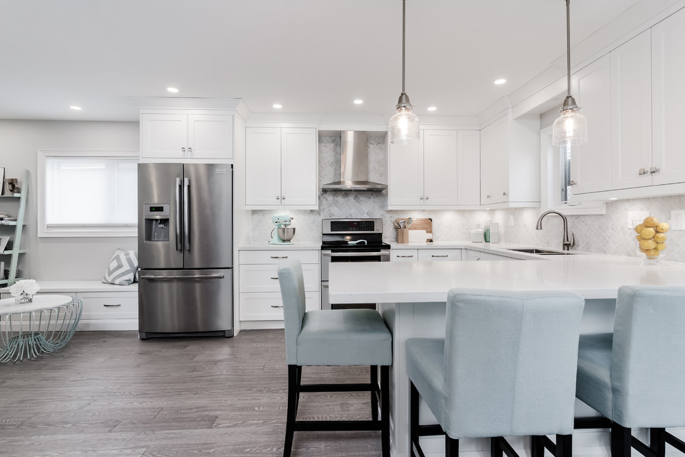 Example of a transitional kitchen design in Toronto