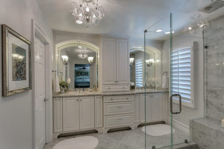Design ideas for a large traditional master bathroom in Los Angeles with an undermount sink, furniture-like cabinets, white cabinets, engineered quartz benchtops, a corner shower, a one-piece toilet, white tile, stone tile, grey walls and marble floors.