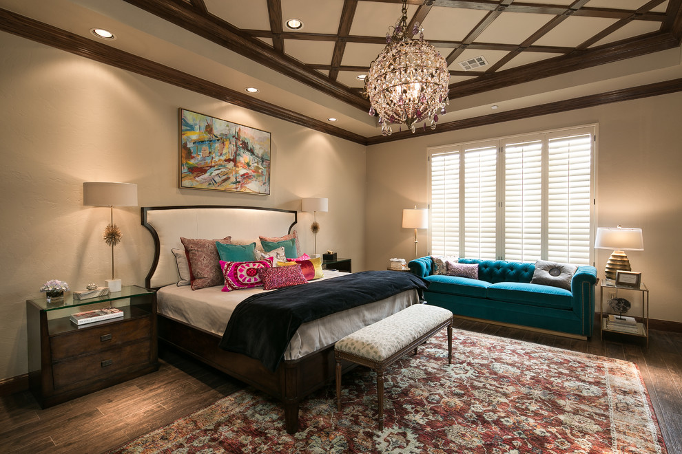 Eclectic master bedroom in Oklahoma City with beige walls and dark hardwood floors.