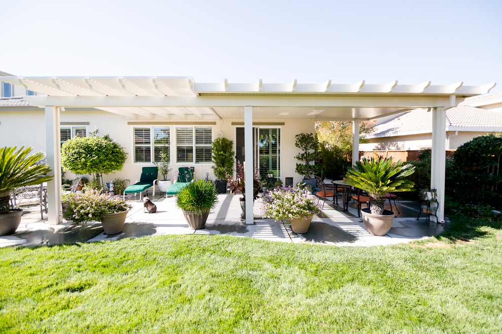 Large traditional backyard patio in San Francisco with concrete slab and a pergola.