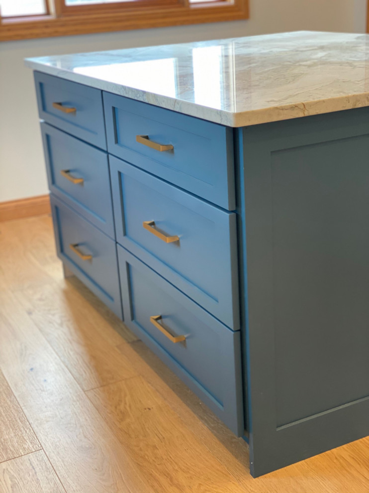 Inspiration for a huge transitional master light wood floor, brown floor and double-sink bathroom remodel with shaker cabinets, green cabinets, marble countertops and a built-in vanity