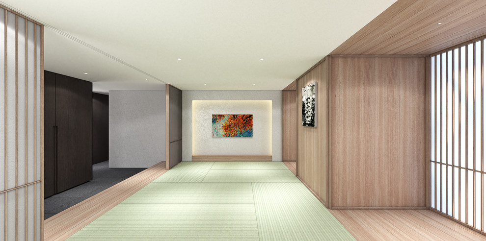 Large contemporary guest bedroom in Tokyo with white walls, tatami floors, no fireplace and green floor.