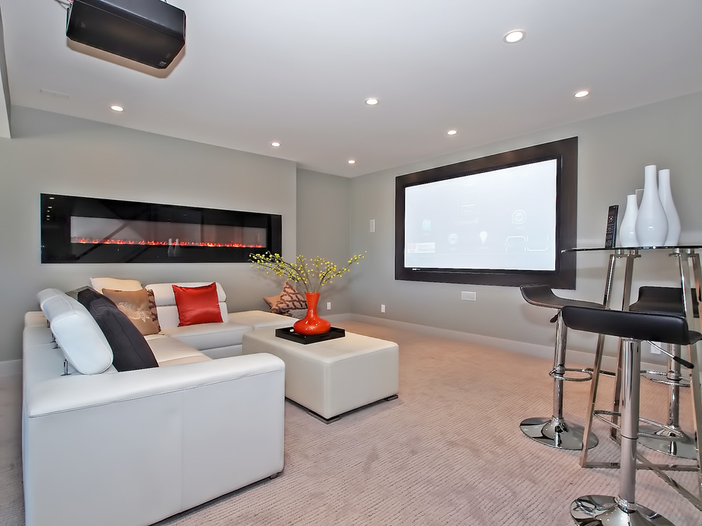 Mid-sized contemporary enclosed home theatre in Calgary with grey walls, carpet and a projector screen.