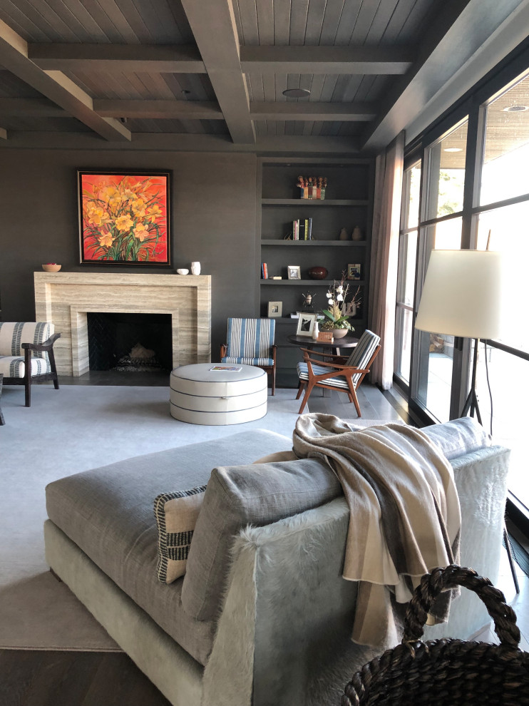 Inspiration for a contemporary enclosed living room in Calgary with a library, grey walls, dark hardwood floors, a standard fireplace, a stone fireplace surround, no tv and brown floor.