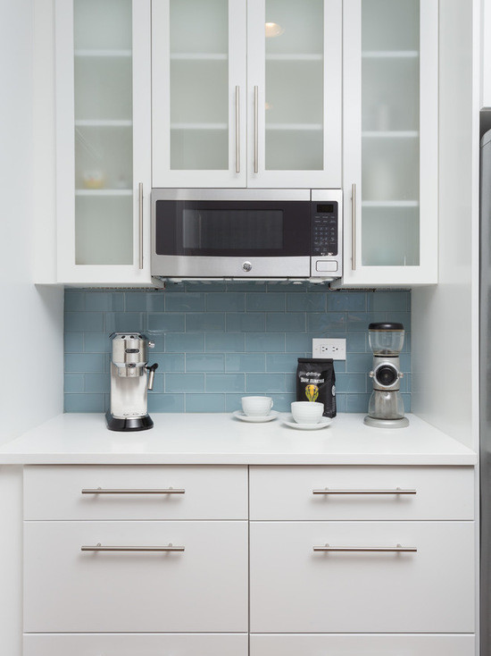 Inspiration for a mid-sized modern galley eat-in kitchen in Chicago with an undermount sink, flat-panel cabinets, white cabinets, copper benchtops, blue splashback, subway tile splashback, stainless steel appliances, medium hardwood floors and no island.