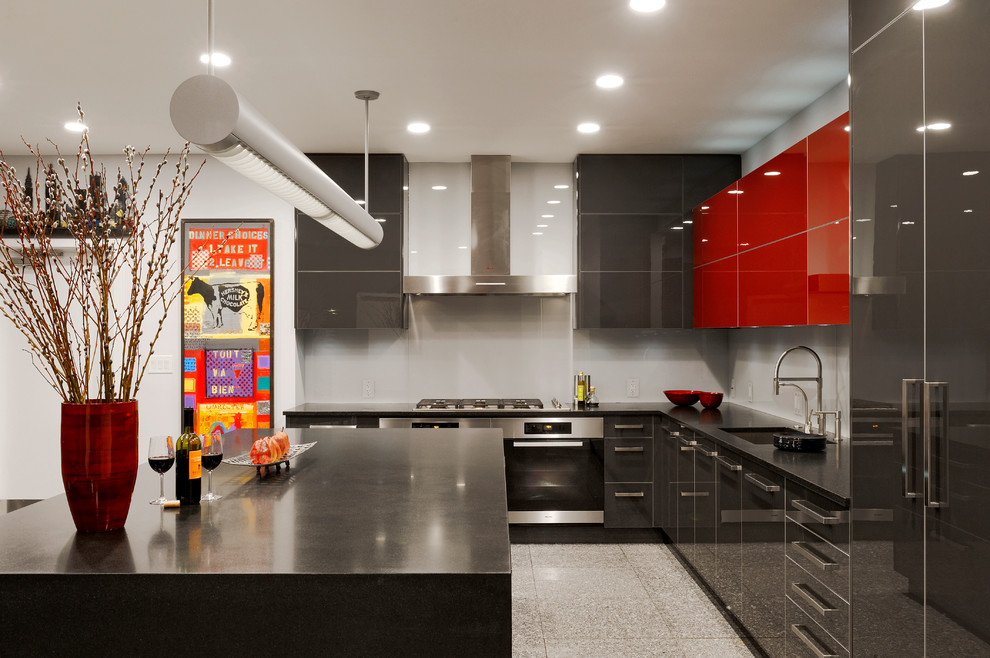 Inspiration for a large contemporary l-shaped kitchen in DC Metro with an undermount sink, flat-panel cabinets, black cabinets, grey splashback, glass sheet splashback, with island, granite benchtops, stainless steel appliances and porcelain floors.