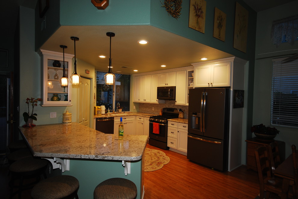 Inspiration for a transitional kitchen remodel with flat-panel cabinets and white cabinets