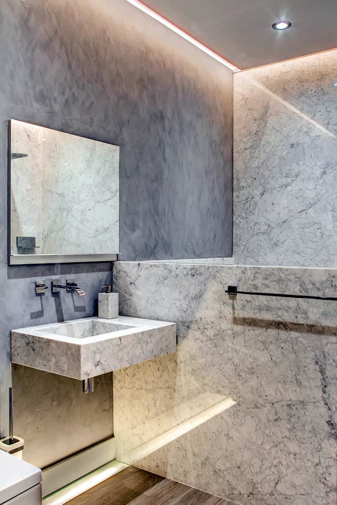 Inspiration for a contemporary bathroom in Denver with a wall-mount sink, gray tile, stone slab, grey walls and dark hardwood floors.