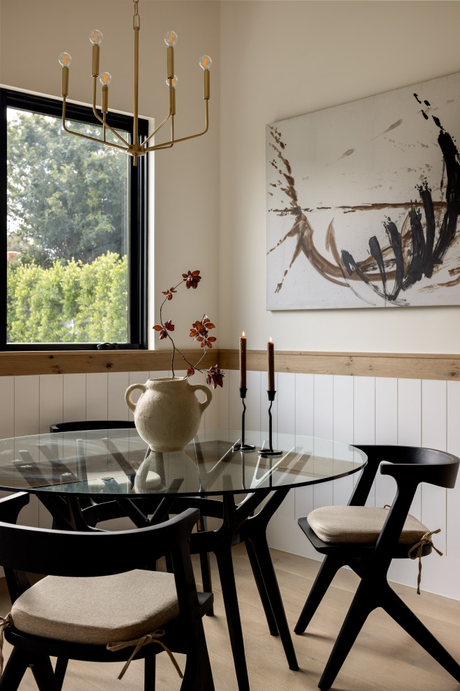Inspiration for a light wood floor and beige floor dining room remodel in Los Angeles with white walls