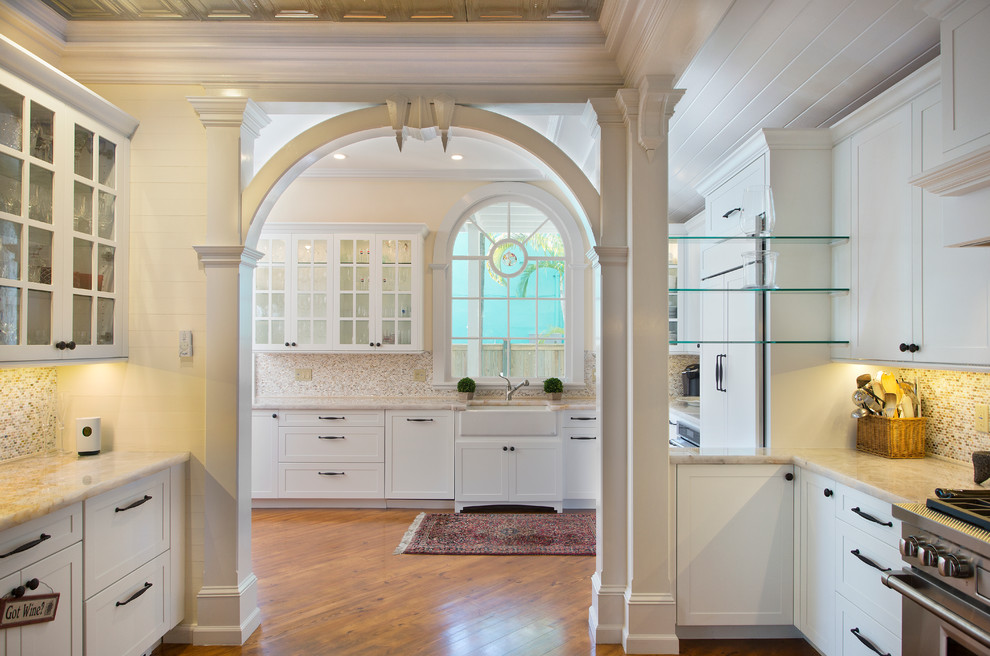 Inspiration for a transitional kitchen remodel in Miami with flat-panel cabinets