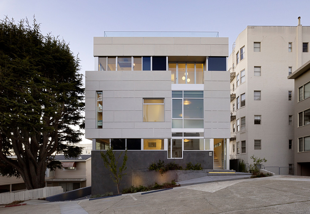 This is an example of a large contemporary three-storey grey exterior in San Francisco with concrete fiberboard siding and a flat roof.