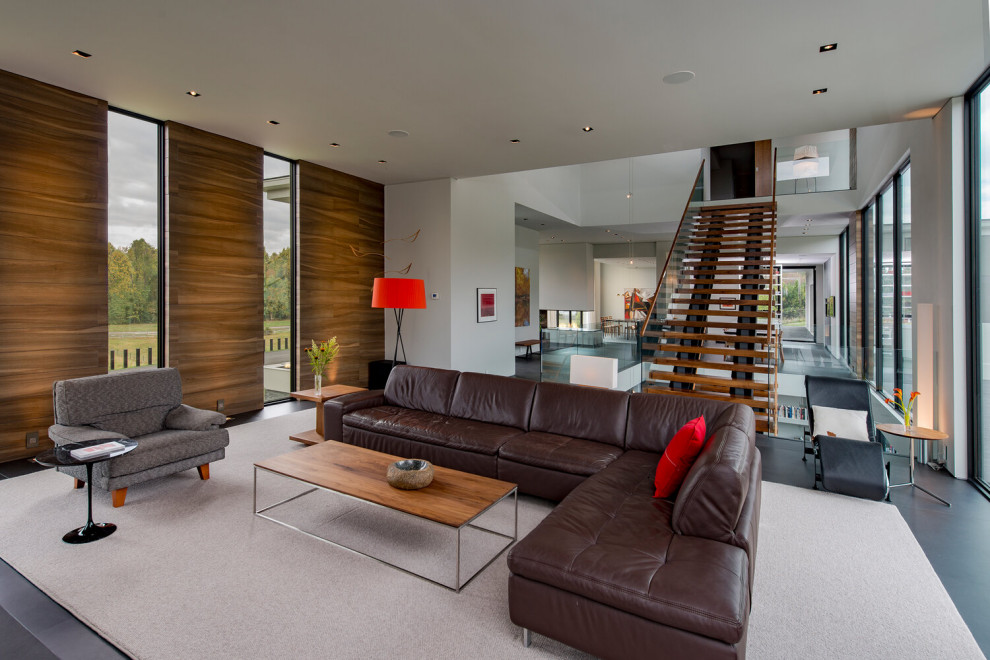 Esempio di un grande soggiorno design stile loft con sala formale, pareti bianche, pavimento in gres porcellanato, pavimento grigio e soffitto ribassato