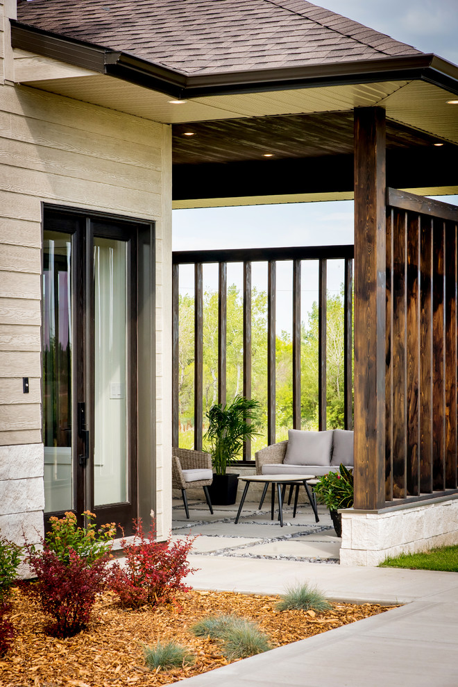 Transitional side yard deck photo with a roof extension