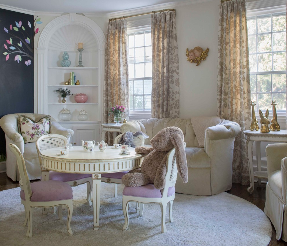 Design ideas for a mid-sized traditional kids' playroom for kids 4-10 years old and girls in New York with beige walls and dark hardwood floors.