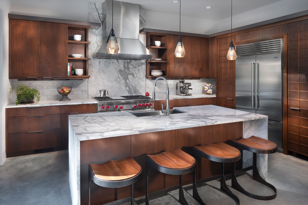 Design ideas for a contemporary l-shaped kitchen in Other with a farmhouse sink, flat-panel cabinets, dark wood cabinets, marble benchtops, white splashback, marble splashback, stainless steel appliances, concrete floors, with island, grey floor and white benchtop.