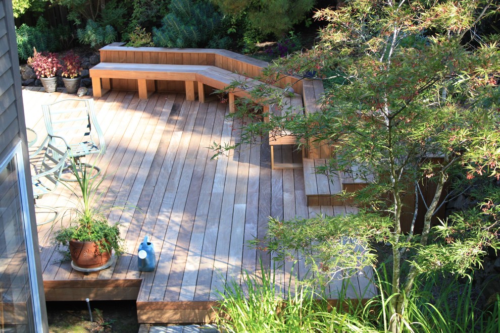 Inspiration for a mid-sized beach style backyard deck in Portland with a container garden and no cover.