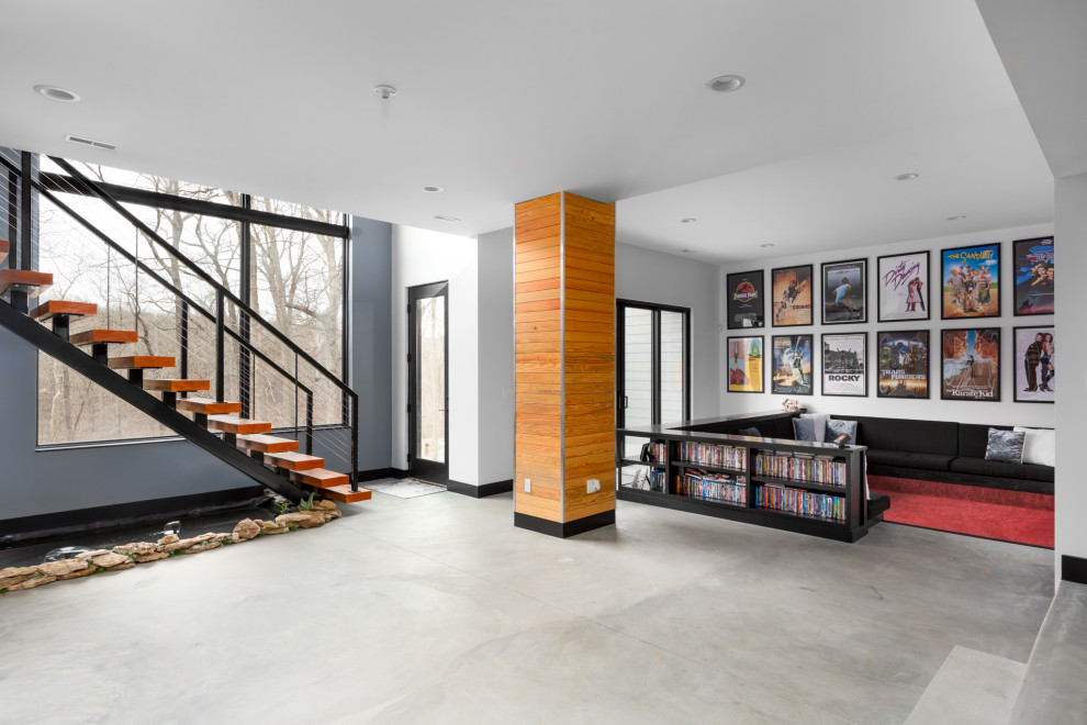 Design ideas for a large midcentury walk-out basement in St Louis with a game room, white walls, concrete floors, no fireplace and grey floor.