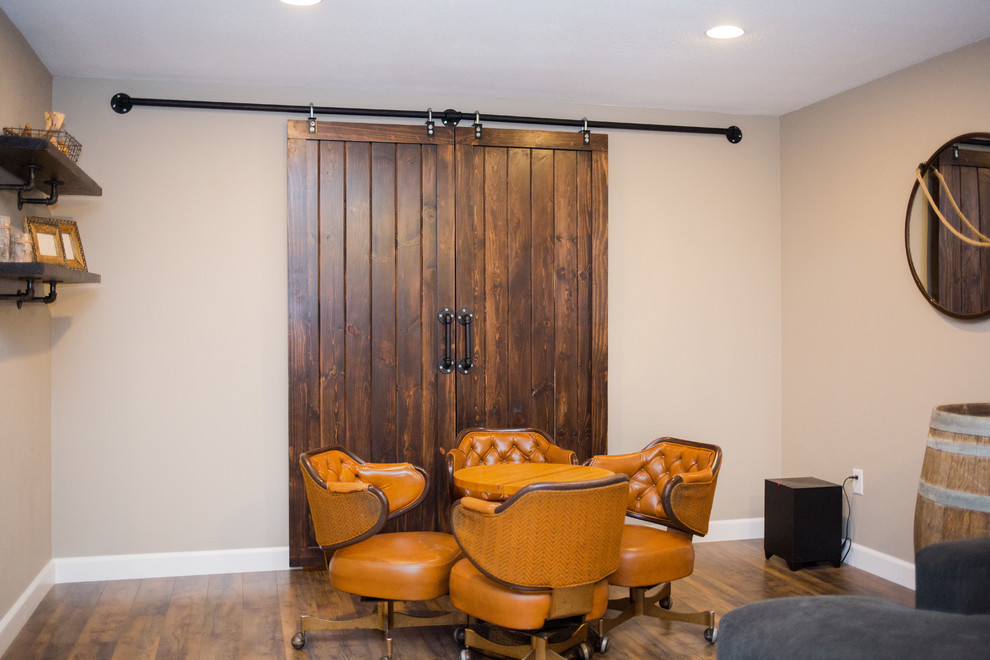 Basement - mid-sized rustic underground medium tone wood floor basement idea in St Louis with beige walls and no fireplace