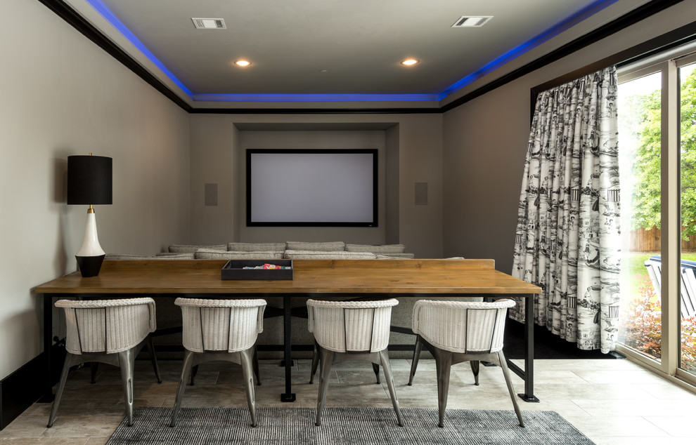 Inspiration for a transitional enclosed home theatre in Dallas with beige walls, carpet, a projector screen and black floor.