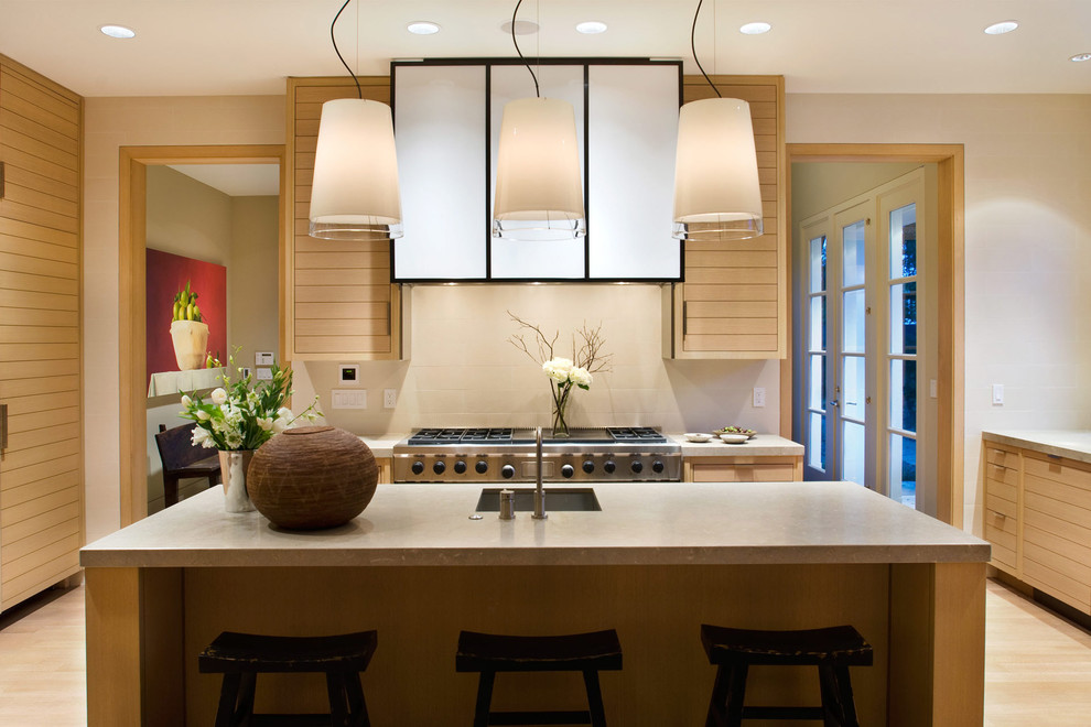 Inspiration for a contemporary kitchen in San Francisco with louvered cabinets and stainless steel appliances.