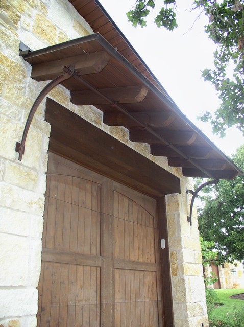 Garage Door Shed Roof And Iron Bracket Support Mediterranean