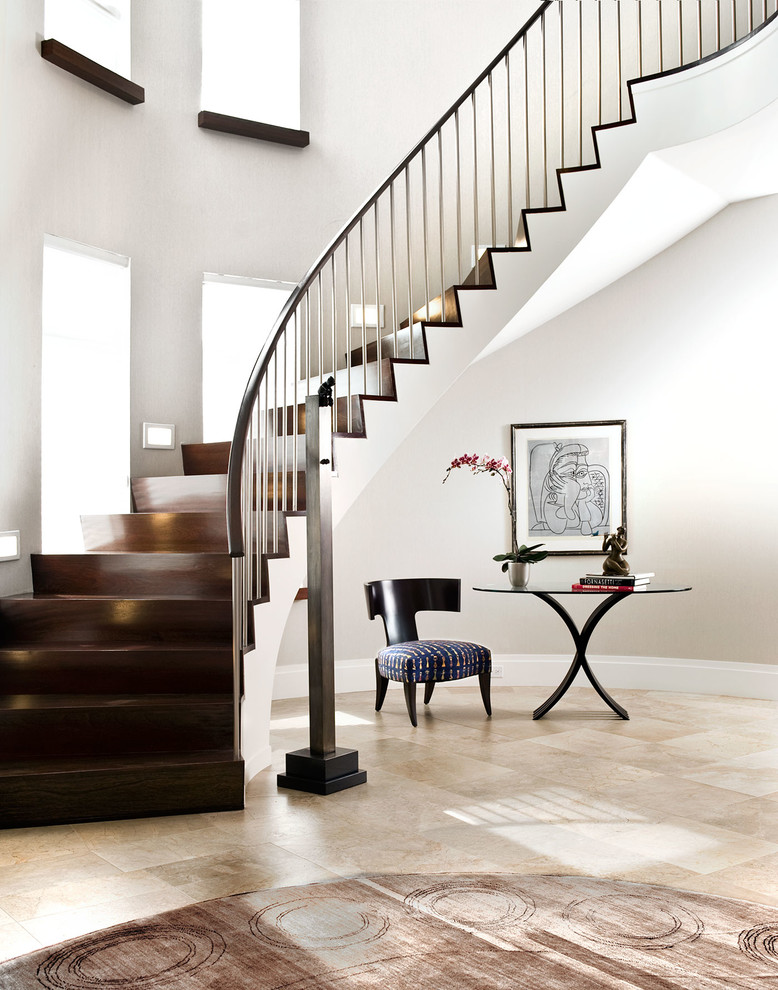 Design ideas for a large contemporary wood spiral staircase in New York with wood risers and mixed railing.