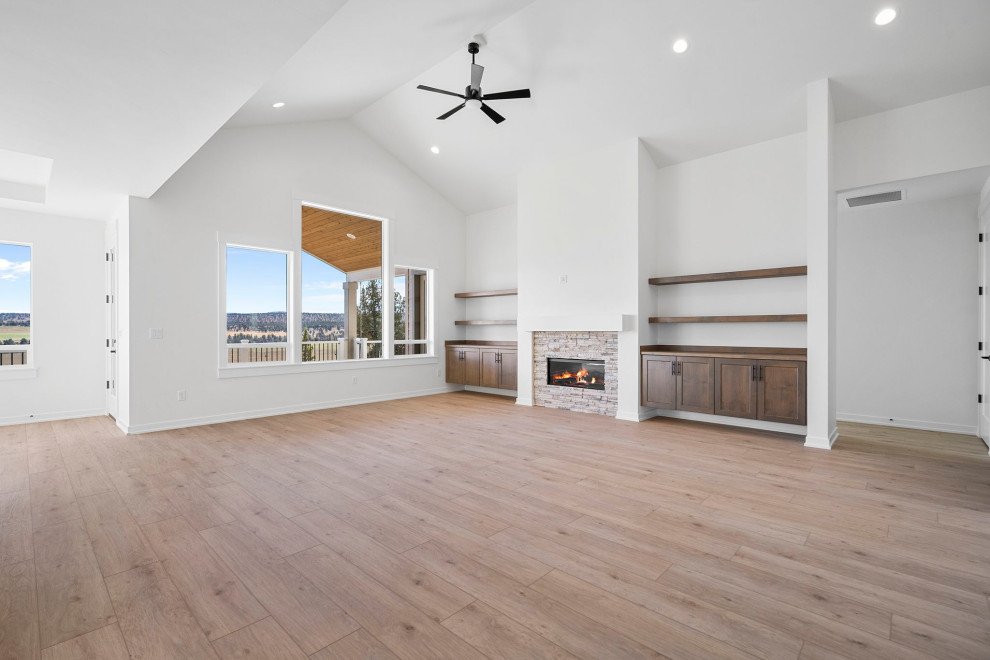 Example of a transitional open concept living room design