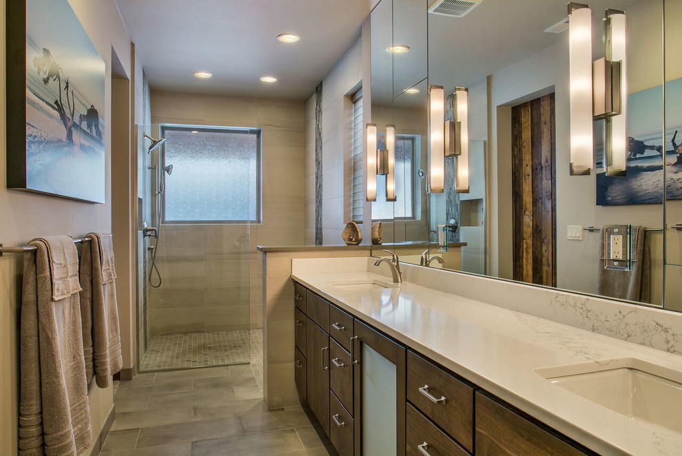 This is an example of a mid-sized traditional master bathroom in Other with flat-panel cabinets, medium wood cabinets, a curbless shower, a two-piece toilet, beige tile, porcelain tile, beige walls, porcelain floors, an undermount sink, engineered quartz benchtops, beige floor and an open shower.