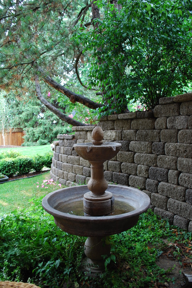Traditional garden in Boise with a water feature.