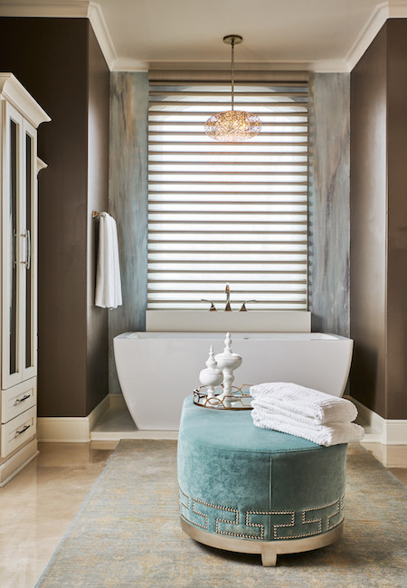 This is an example of a mid-sized transitional master bathroom in Other with a one-piece toilet, brown walls, a vessel sink, marble benchtops, beige floor, shaker cabinets, white cabinets, a freestanding tub, multi-coloured tile, glass tile and concrete floors.