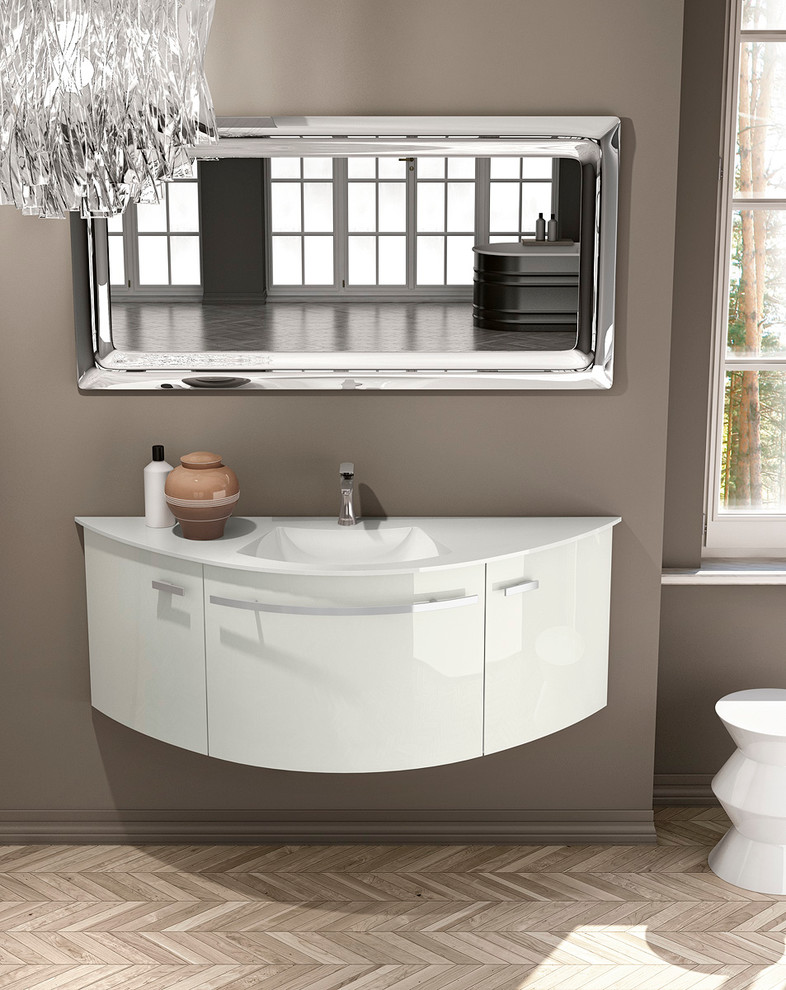 This is an example of a small modern 3/4 bathroom in San Diego with an integrated sink, flat-panel cabinets, beige cabinets, glass benchtops, a freestanding tub, a corner shower, a one-piece toilet, gray tile, ceramic tile, grey walls and medium hardwood floors.