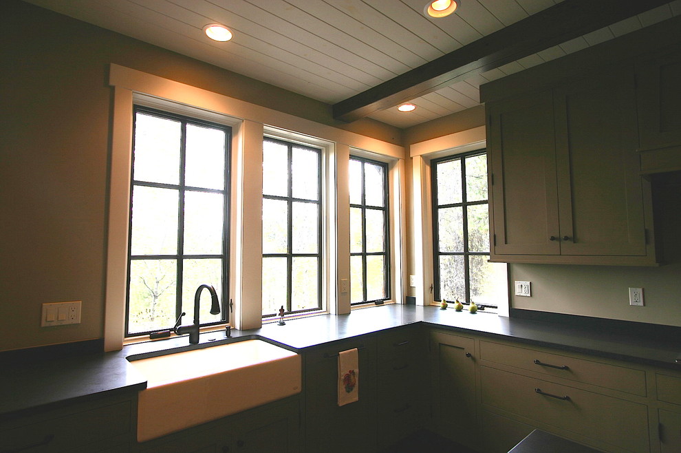 Mountain style dark wood floor kitchen photo in Boise with an island