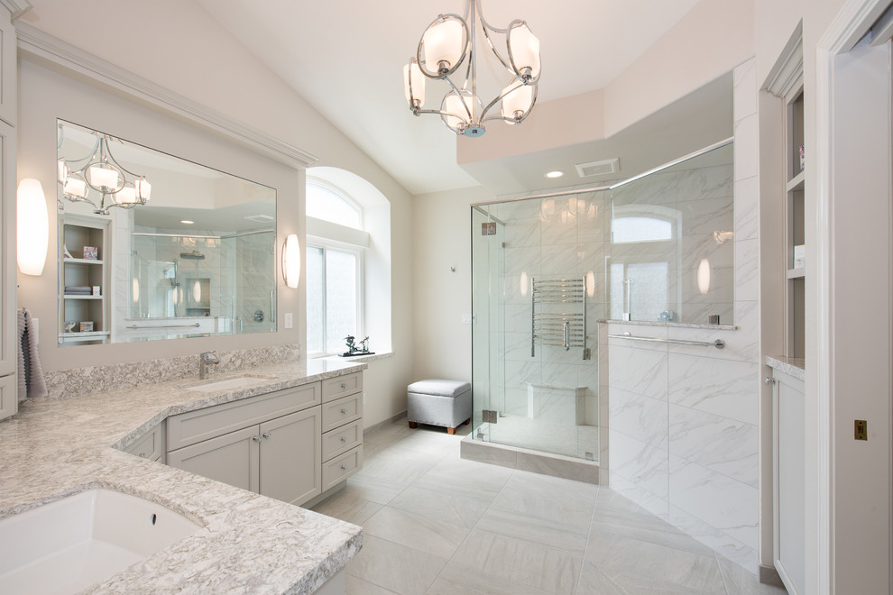 Inspiration for a mid-sized contemporary master bathroom in Orange County with flat-panel cabinets, white cabinets, a corner shower, a one-piece toilet, white tile, porcelain tile, white walls, porcelain floors, an undermount sink, engineered quartz benchtops and white floor.
