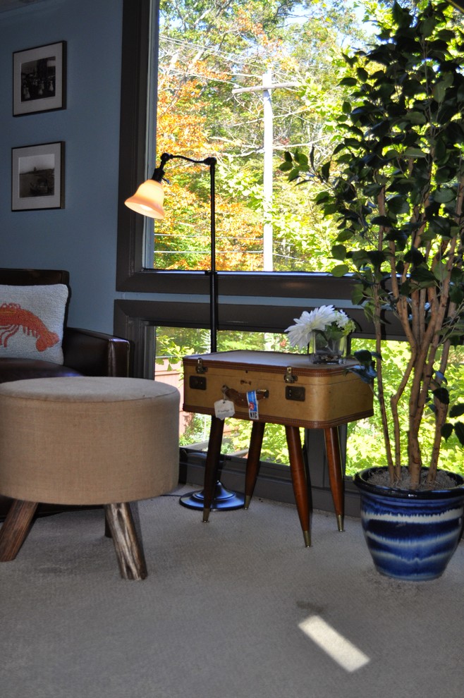 Inspiration for a mid-sized eclectic master bedroom remodel in Boston with blue walls