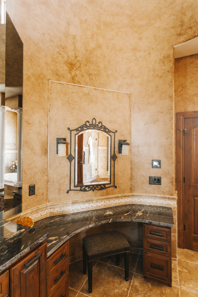 Example of a transitional beige tile slate floor bathroom design with recessed-panel cabinets, dark wood cabinets, granite countertops and beige walls