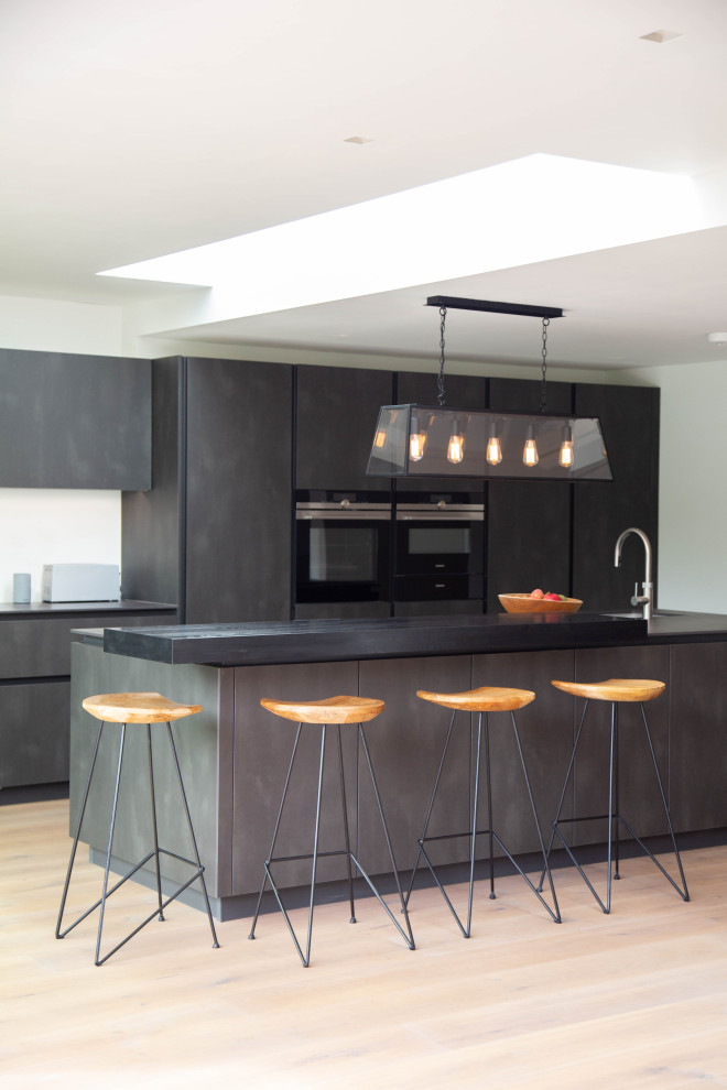 Design ideas for an expansive contemporary open plan kitchen in London with with island.