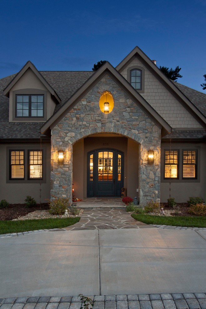 Example of a mid-sized transitional foyer design with multicolored walls and a blue front door