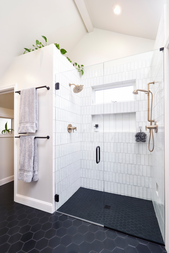 Design ideas for a mid-sized modern master bathroom in Portland with flat-panel cabinets, brown cabinets, a curbless shower, a wall-mount toilet, white tile, ceramic tile, white walls, porcelain floors, an undermount sink, engineered quartz benchtops, black floor, a hinged shower door, white benchtops, an enclosed toilet, a double vanity, a floating vanity and vaulted.